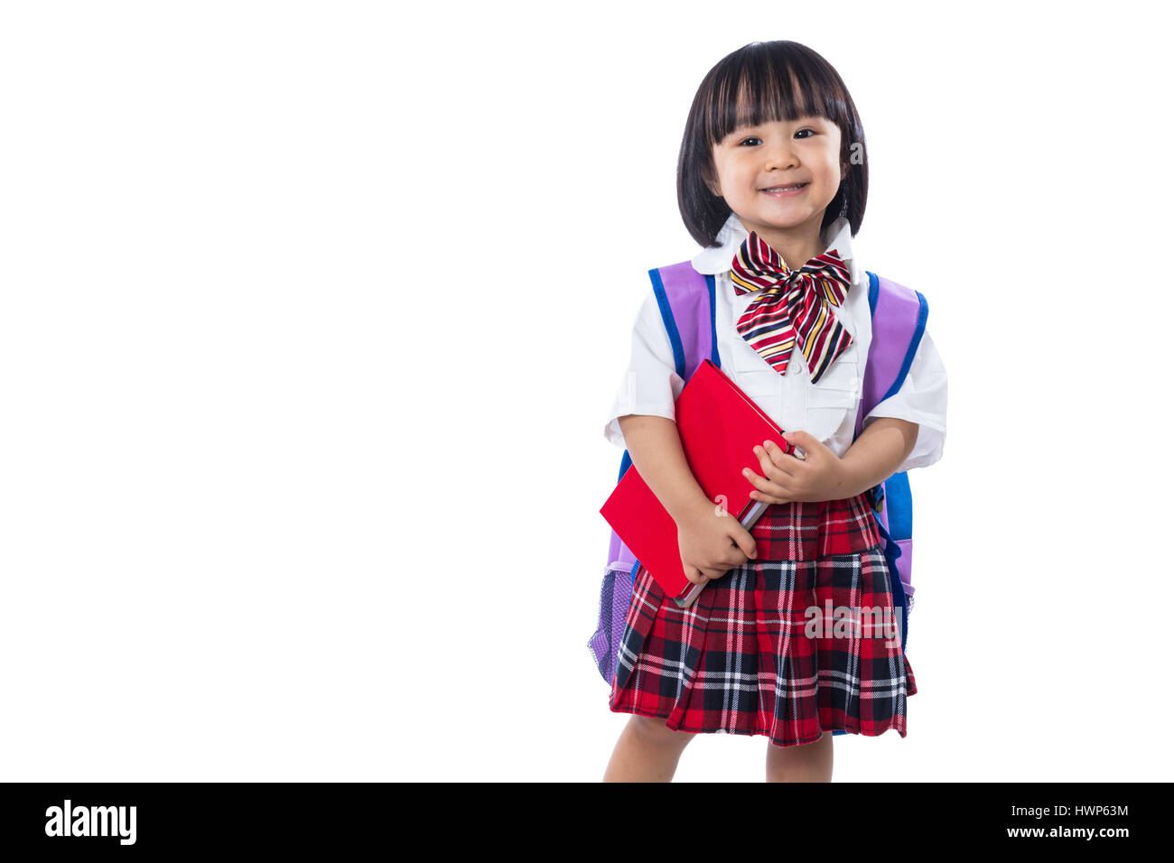 Happy Asian Chinese little student girl with school bag and books in ...