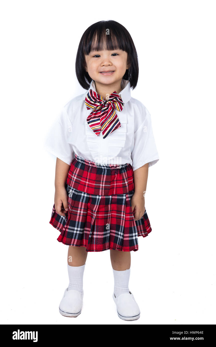 Happy Asian Chinese little girl wearing student uniform in isolated ...