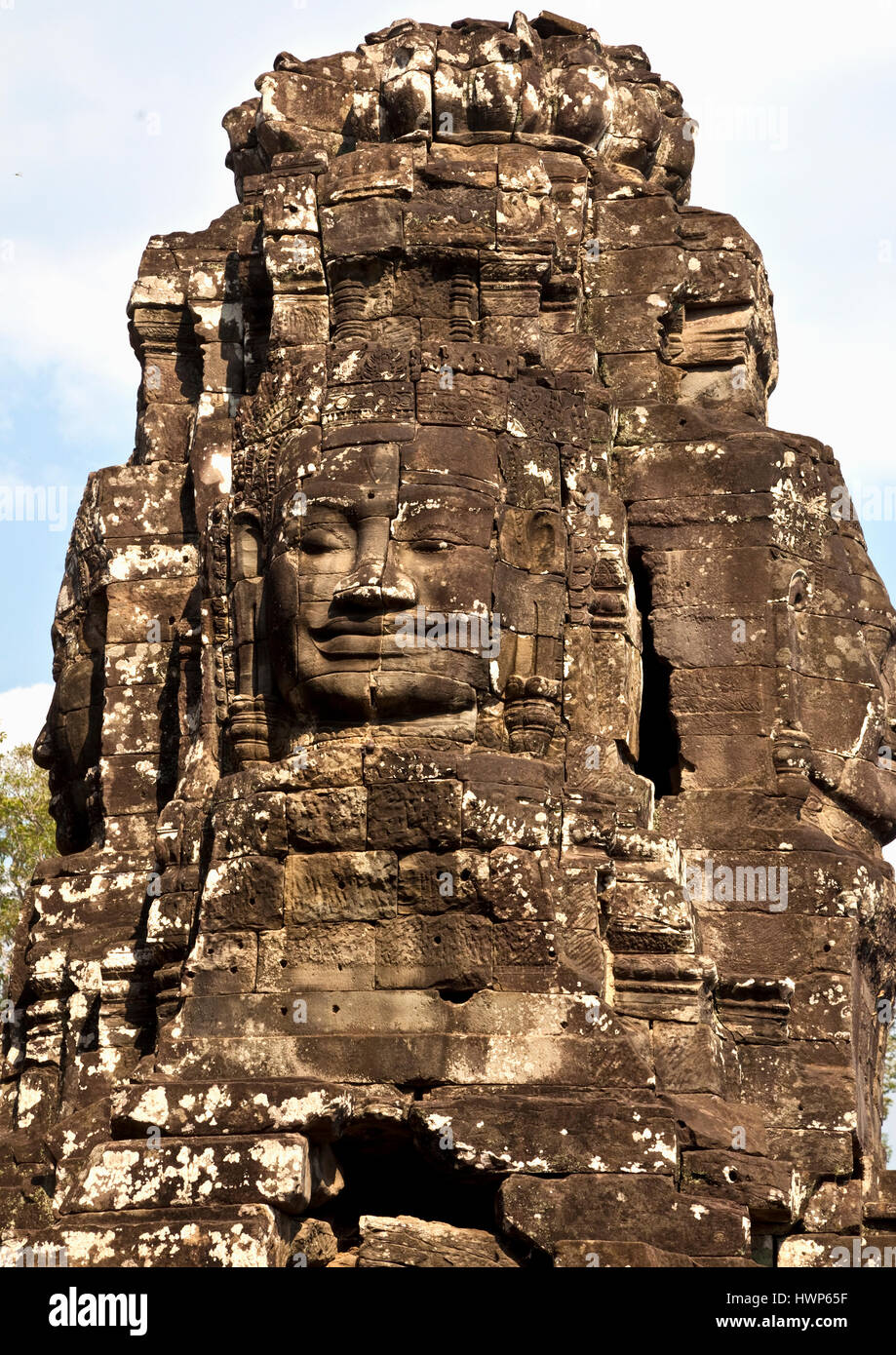 One of the many faces at the Temple of Bayon at Angkor Thom Stock Photo