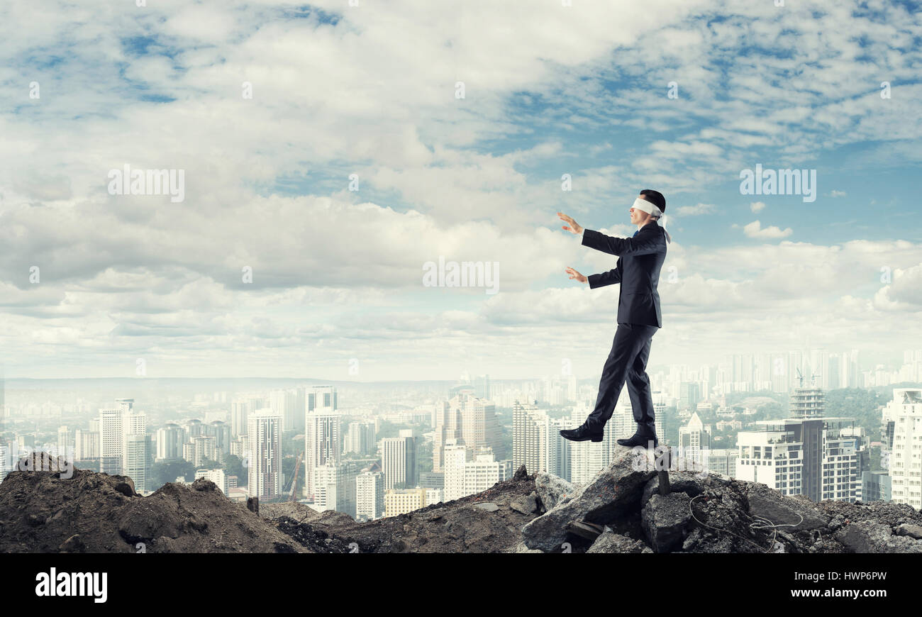 Portrait Blindfolded Man Stretching His Arms Out Walking Through Many  Question Marks Isolated On Gray Wall Background Stock Photo, Picture and  Royalty Free Image. Image 64446917.