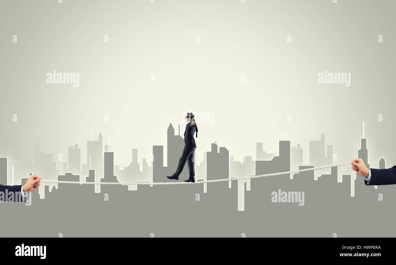 Business concept of risk support and assistance with man balancing on ...