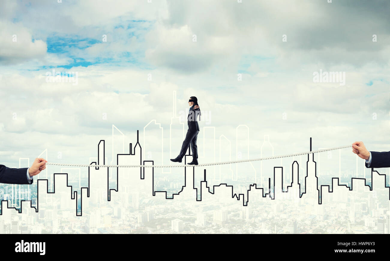 Business concept of risk support and assistance with man balancing on ...