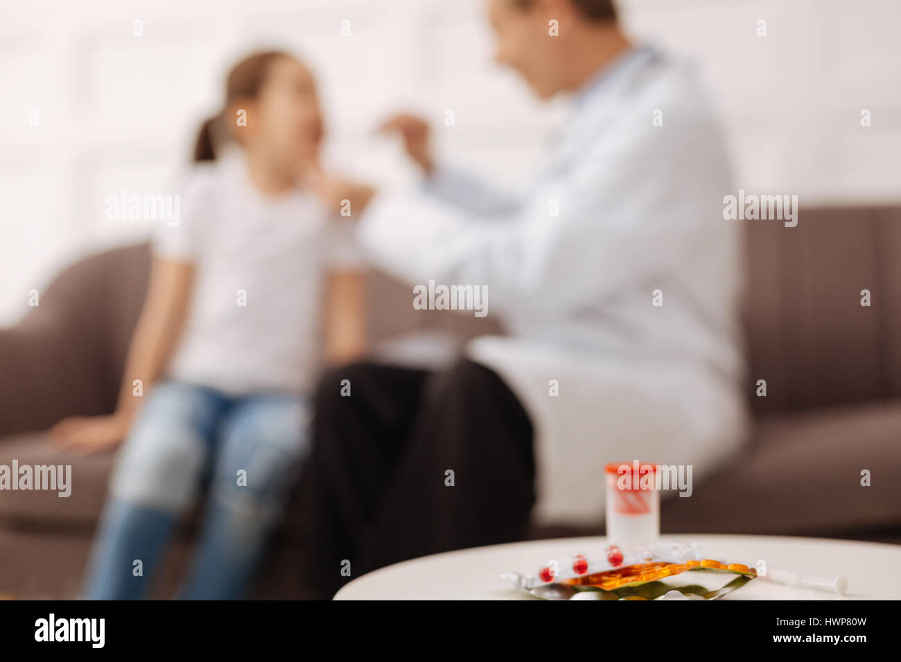 Vitamins for health. Competent pleasant private doctor doing some tests