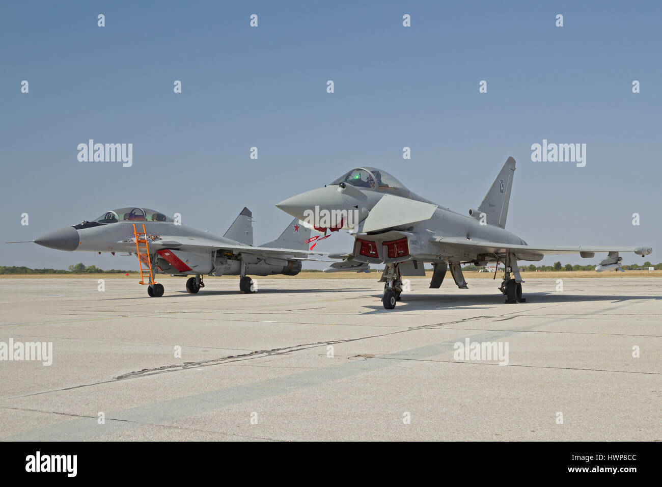 Italian Eurofighter Typhoon and Russian Mikoyan MiG-29 Fulcrum after performance on International Air Show "Batajnica 2012" in Belgrade, Serbia Stock Photo