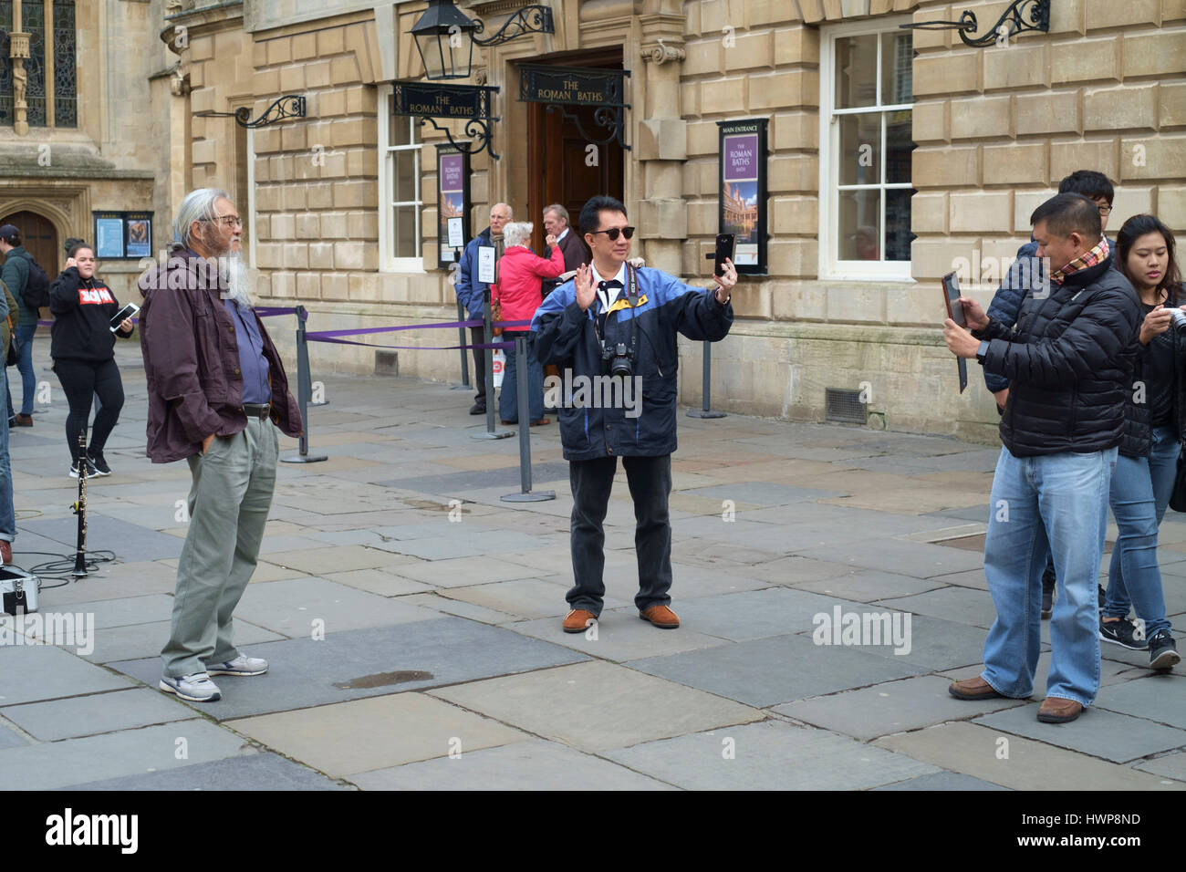 Tourists in the Abbey Court Yard Bath Somerset England UK Stock Photo