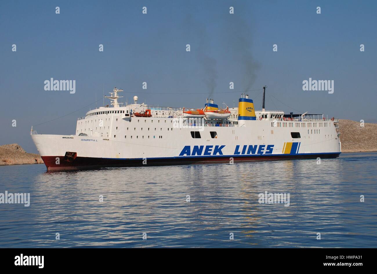 ANEK Lines ferry boat Ierapetra L docking at Emborio harbour on the Greek island of Halki. The 137mtr vessel was built in 1975 in Japan. Stock Photo