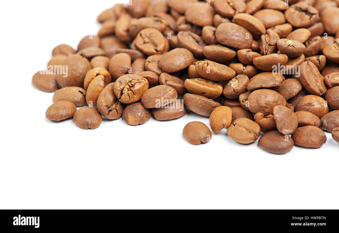 Heap of coffee beans isolated on white background Stock Photo - Alamy