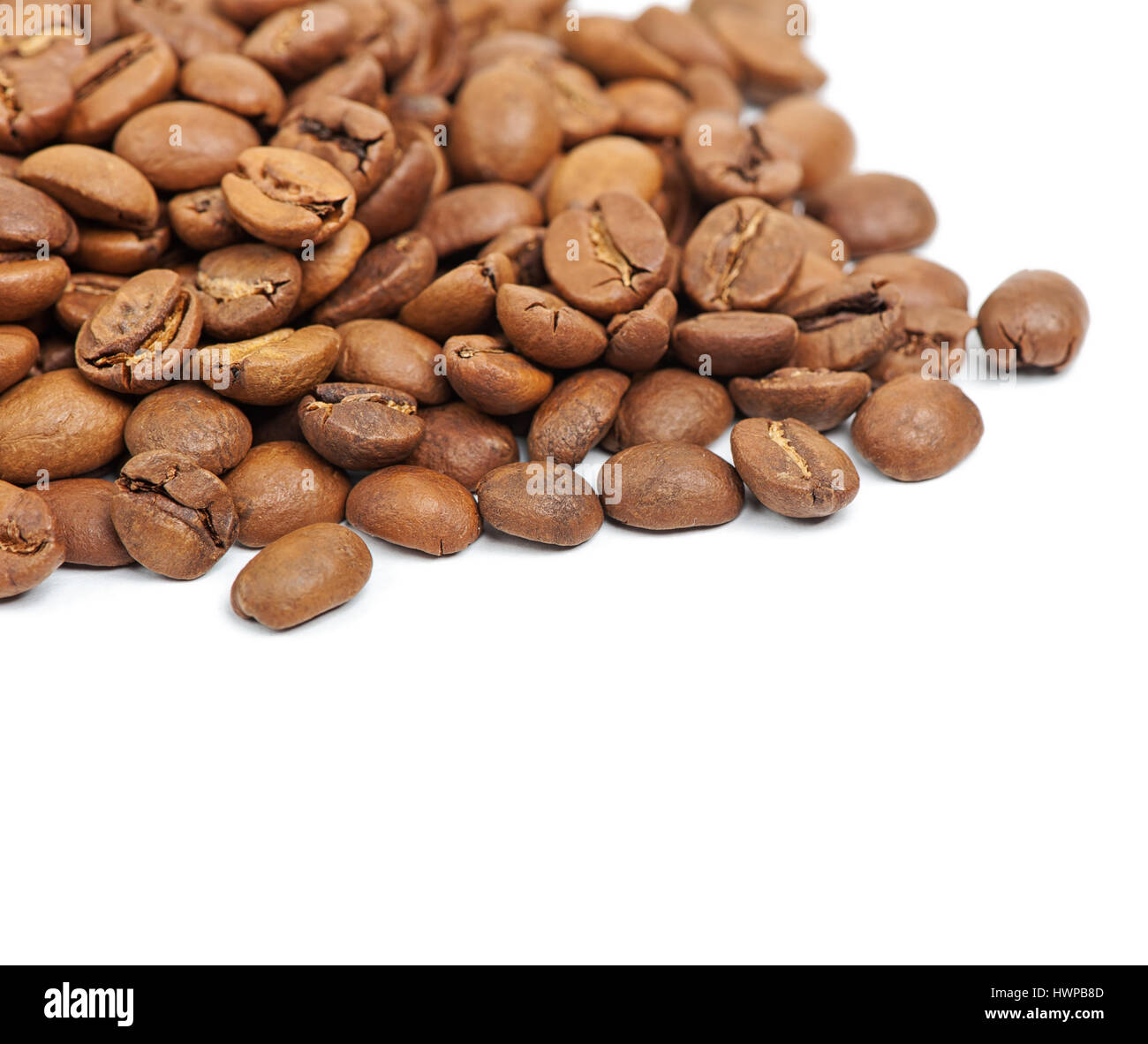 Heap of coffee beans isolated on white background Stock Photo - Alamy