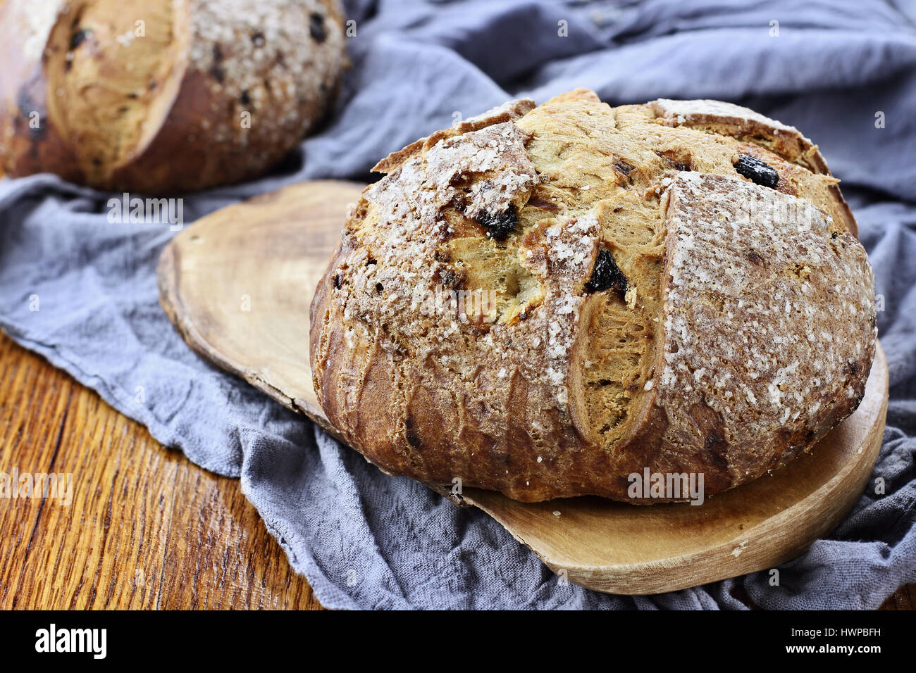 Irish soda bread in a rustic setting on an old wood table top. Stock Photo