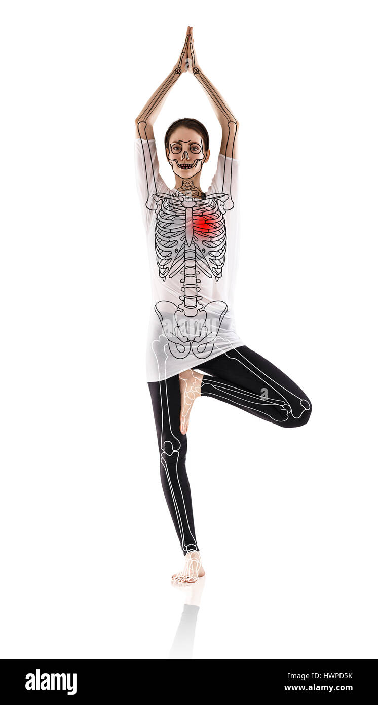 Woman in yoga pose, with drawing skeleton over white background. Stock Photo