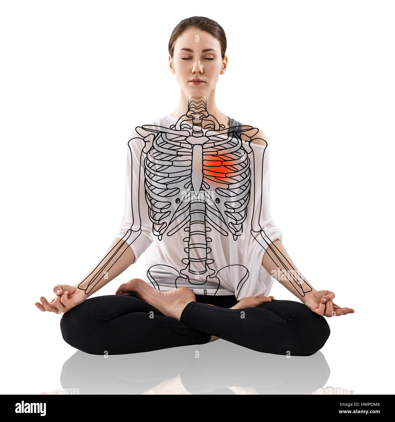 Woman in a yoga pose, with drawing skeleton over white background. Stock Photo