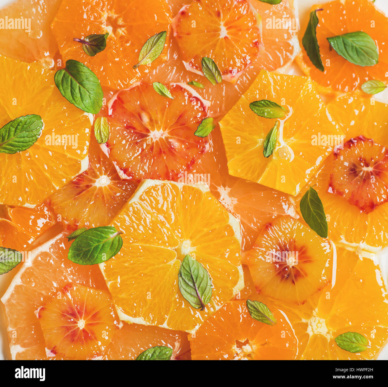 Fresh citrus fruit salad with mint and honey, close-up Stock Photo