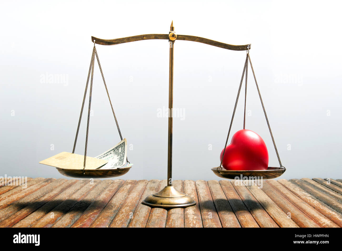 balance your health and make money for life time with scales on wood table and  background Stock Photo