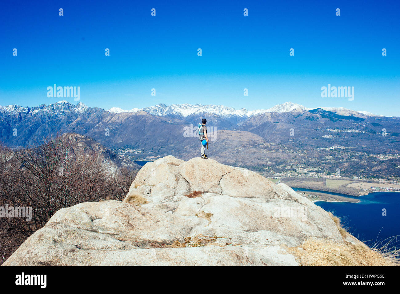 climber on top of mountain, Baveno, Piedmont, Italy Stock Photo