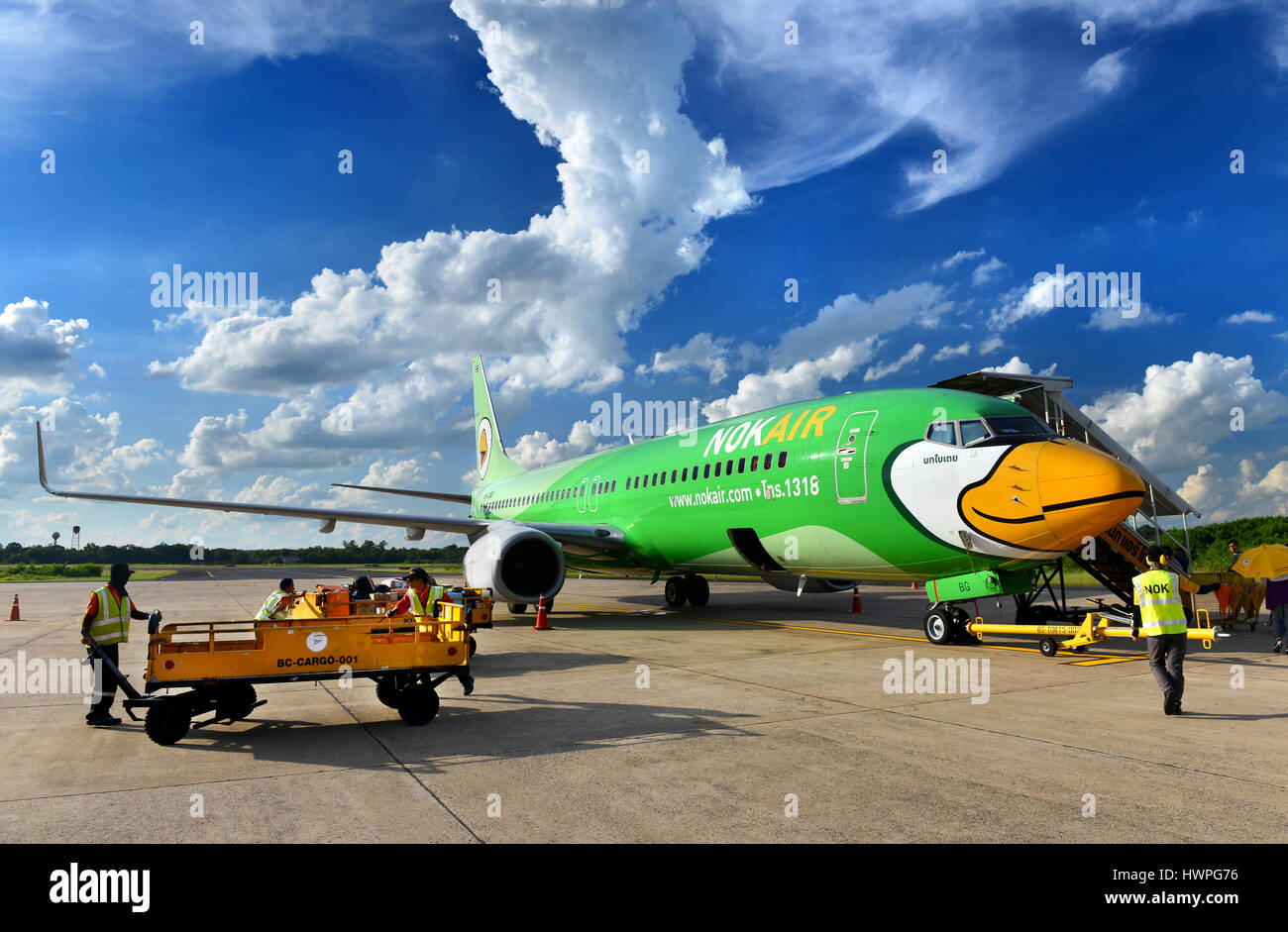 Udon Thani,Thailand August 22, 2015:Boeing 737-8FH from Nok air airline ,parking at the Udon Thani airport and unidentified men are working with the p Stock Photo