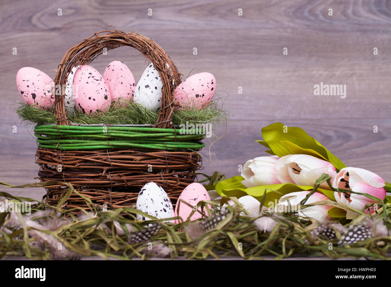 Easter decoration with eggs on a wooden background Stock Photo - Alamy