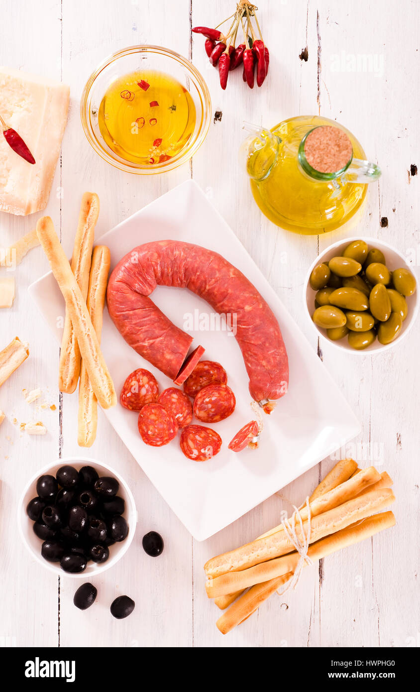 Grissini breadsticks with salami Stock Photo Alamy