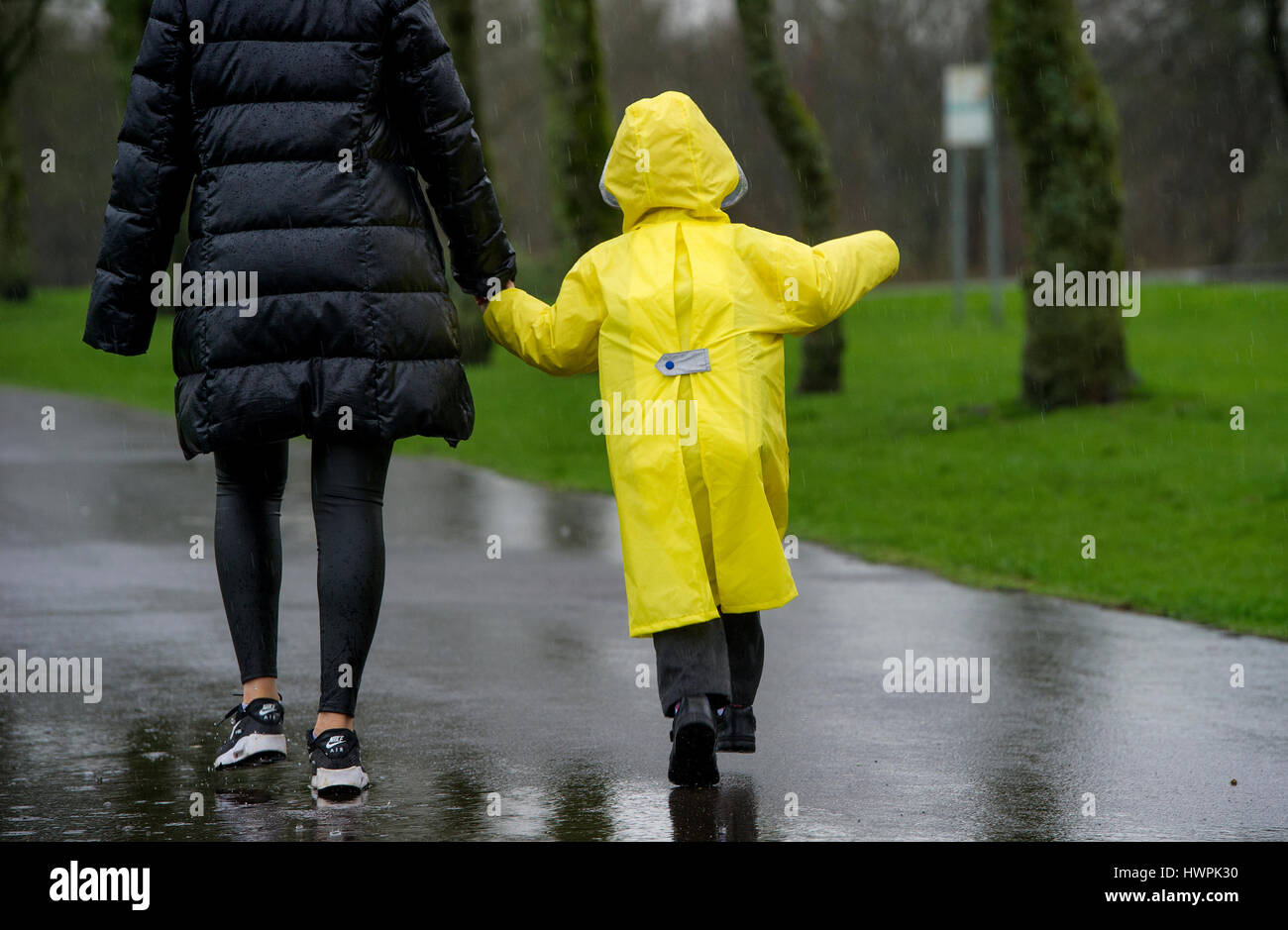 Bolton, UK. 22nd Mar, 2017. A wet walk to school through Leverhulme Park in Bolton, Lancashire, as torrential rain hampers the morning commute. Picture by Paul Heyes, Wednesday March 22, 2017. Credit: Paul Heyes/Alamy Live News Stock Photo