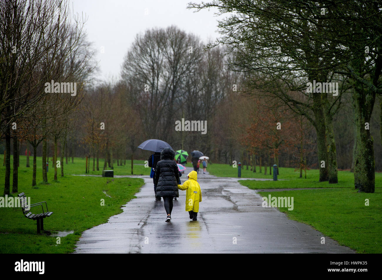 Bolton, UK. 22nd Mar, 2017. A wet walk to school through Leverhulme Park in Bolton, Lancashire, as torrential rain hampers the morning commute. Picture by Paul Heyes, Wednesday March 22, 2017. Credit: Paul Heyes/Alamy Live News Stock Photo