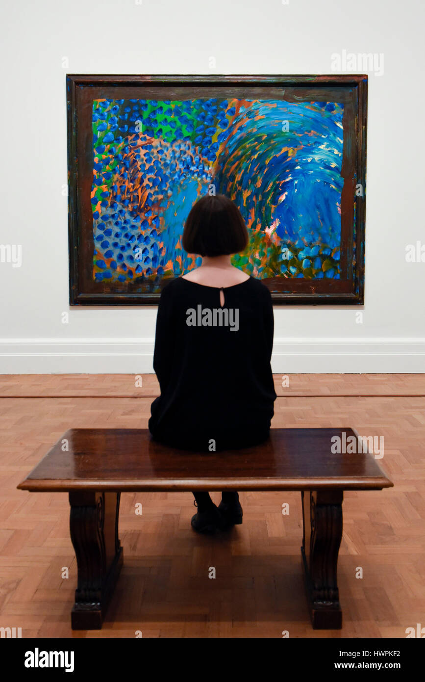 London, UK.  22 March 2017.  A staff member views 'Chez Stamos', 1998, by Howard Hodgkin. Press preview of 'Howard Hodgkin: Absent Friends', the first ever exhibition devoted to the portraits of the British painter Howard Hodgkin, who died on 9 March aged 84.  Taking place at the National Portrait Gallery, the exhibition runs 23 March to 18 June 2017. Credit: Stephen Chung / Alamy Live News Stock Photo
