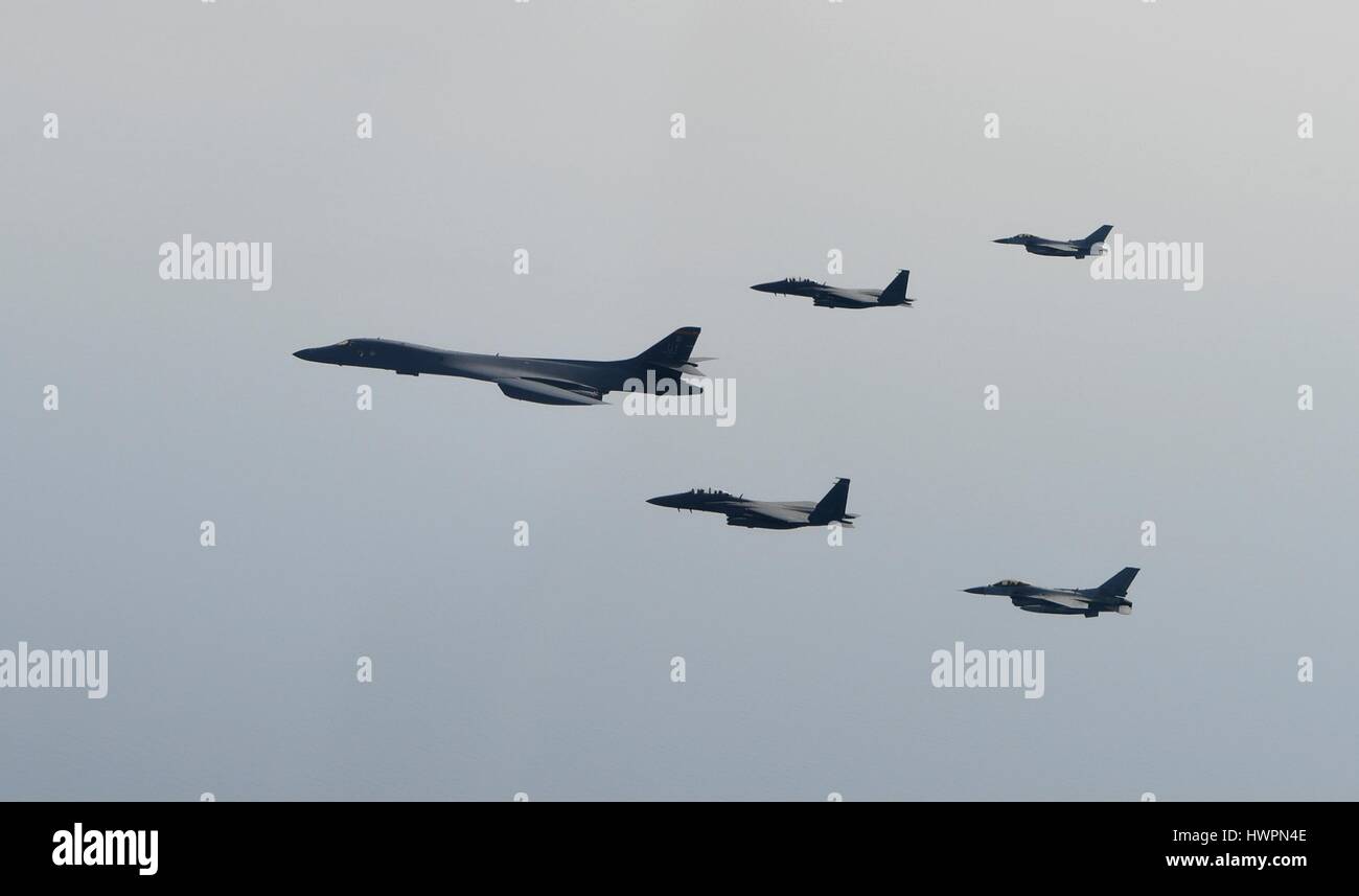 South Korea. 22nd March 2017. A U.S. Air Force B-1B Lancer bomber is escorted by Japanese and South Korean Air Force fighter jets during a joint mission March 22, 2017 over South Korea. The joint show of forces comes after the latest North Korean ballistic missile launch test ended in failure. Credit: Planetpix/Alamy Live News Stock Photo