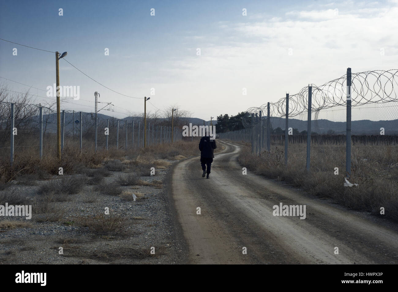 Gevgelija, Republic of Macedonia. 13th Feb, 2017. A Macedonian police officer patrols the border of Macedonia with Greece in Gevgelija. Credit: Jordi Boixareu/ZUMA Wire/Alamy Live News Stock Photo
