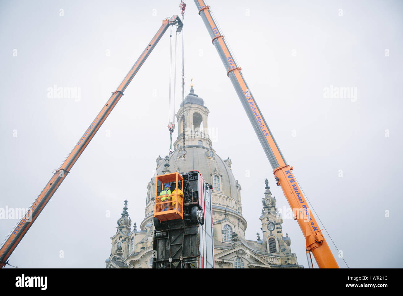 Dresden, Germany. 4th Apr, 2017. The bus installation "Monument" is disassembled at the Neumarkt in Dresden, Germany, 4 April 2017. The three vertically placed busses of the artist Manaf Halbouni will be moved to the Gorki theatre in Berlin. Photo: Oliver Killig/dpa-Zentralbild/dpa/Alamy Live News Stock Photo
