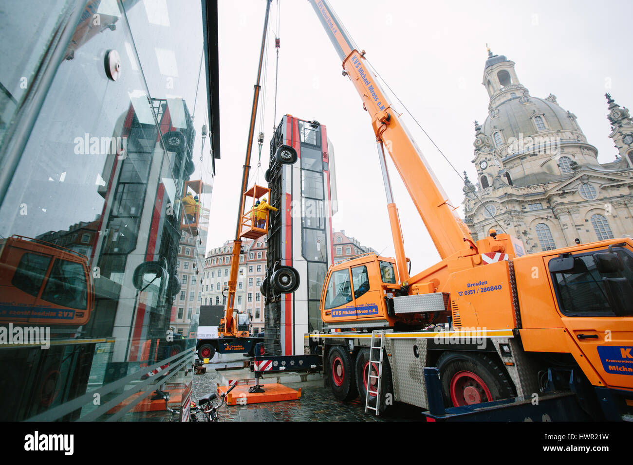 Dresden, Germany. 4th Apr, 2017. The bus installation "Monument" is disassembled at the Neumarkt in Dresden, Germany, 4 April 2017. The three vertically placed busses of the artist Manaf Halbouni will be moved to the Gorki theatre in Berlin. Photo: Oliver Killig/dpa-Zentralbild/dpa/Alamy Live News Stock Photo