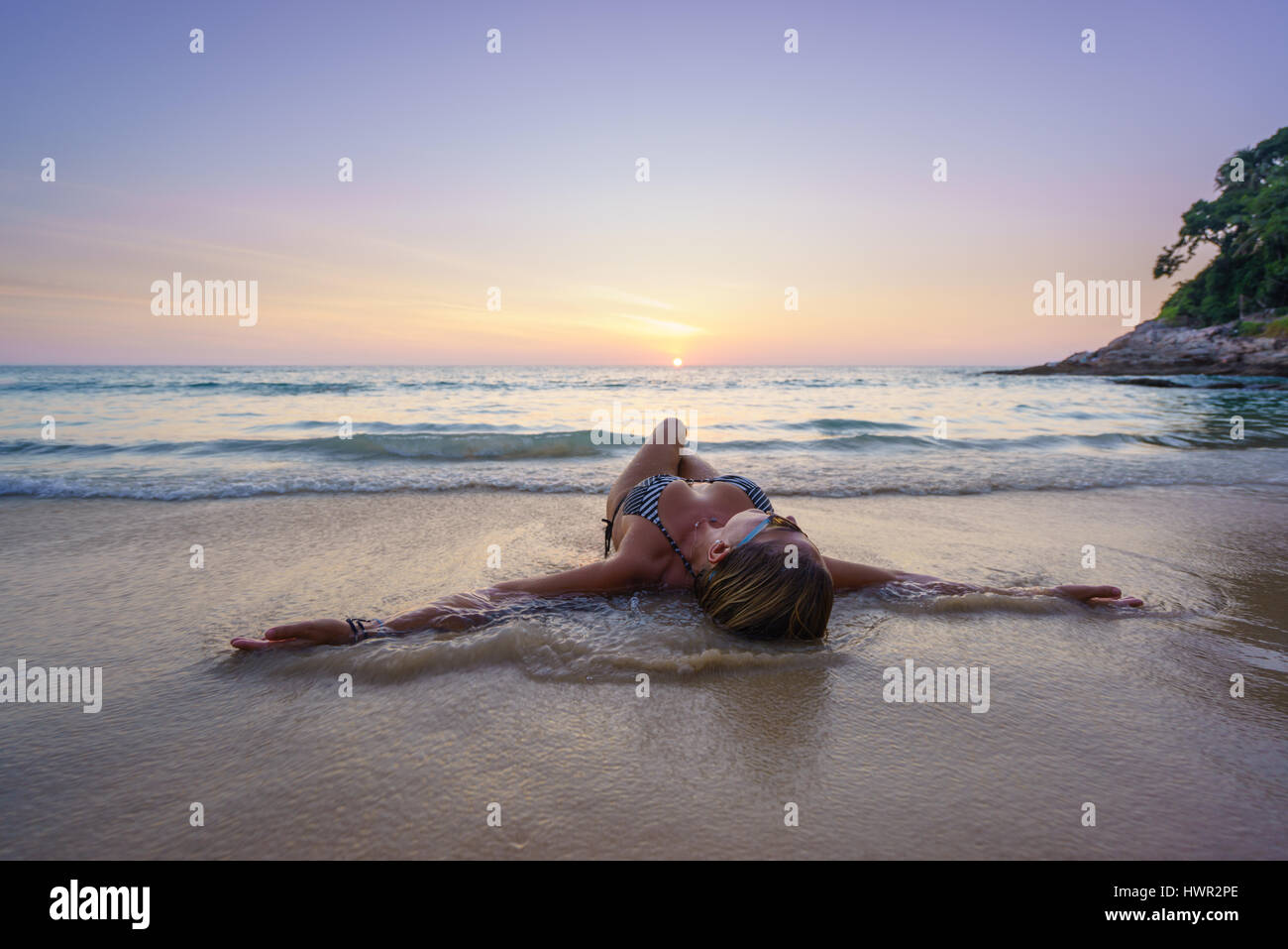 Woman on the beach in Surin Phuket Thailand Stock Photo