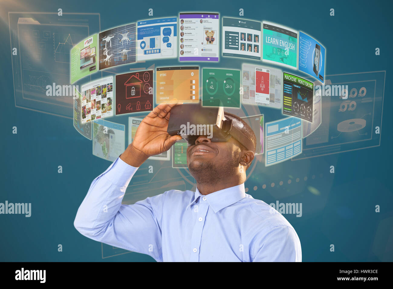 Man sitting on chair and using virtual reality headset against white ...
