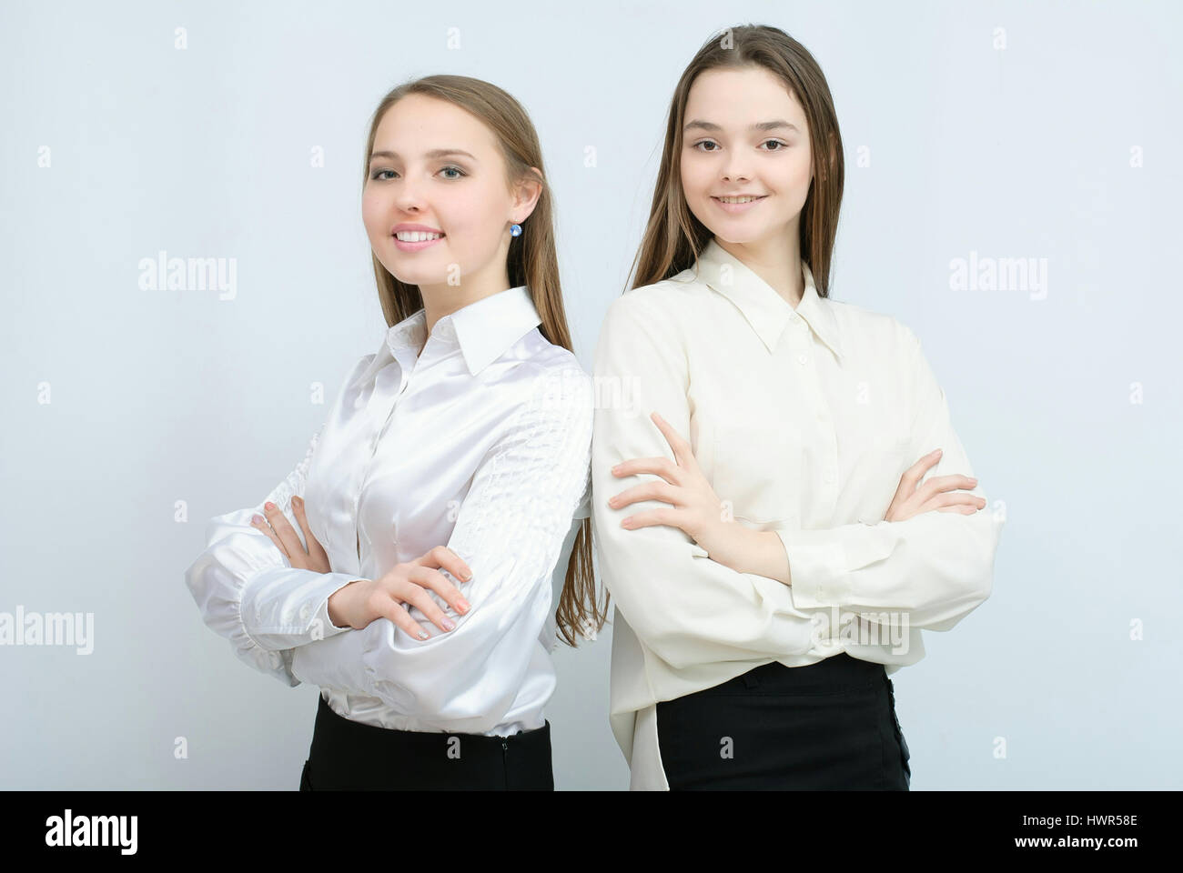 two business models standing with their backs together Stock Photo Alamy