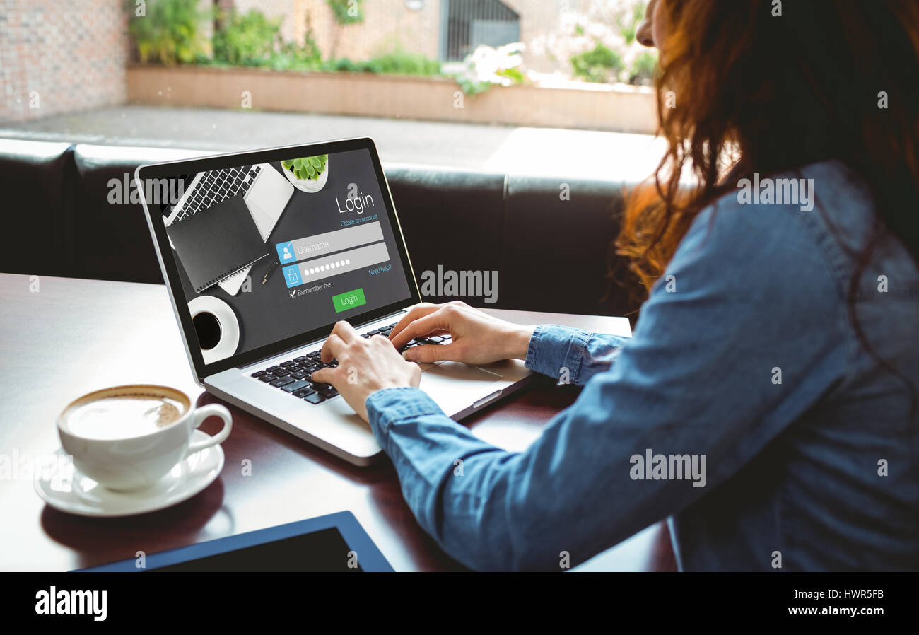 Close-up of login page against mature student using laptop in cafe Stock Photo