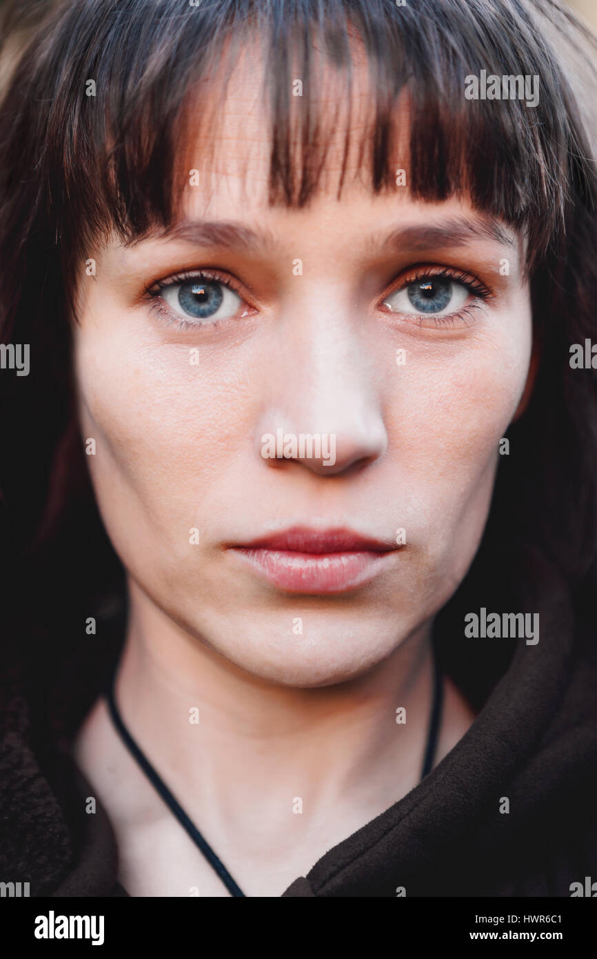 Beautiful woman with blue eyes in the park Stock Photo Alamy