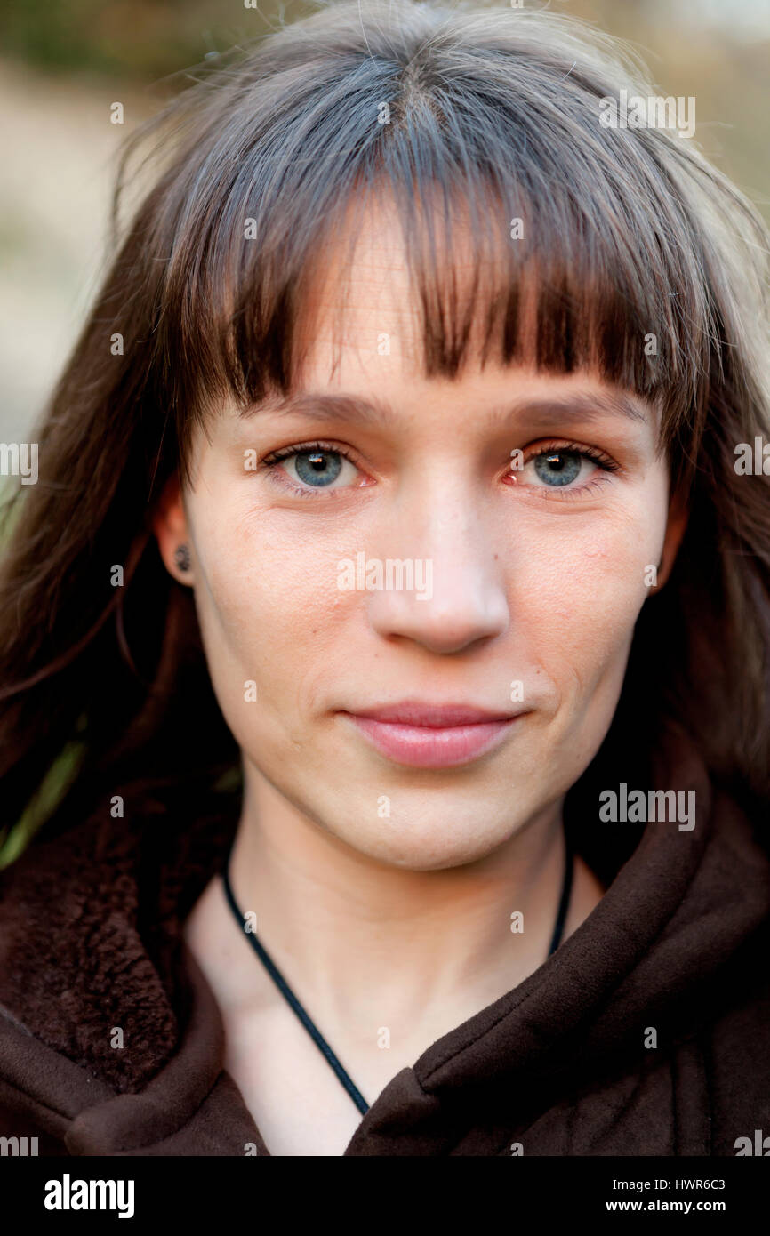 Beautiful woman with blue eyes in the park Stock Photo Alamy