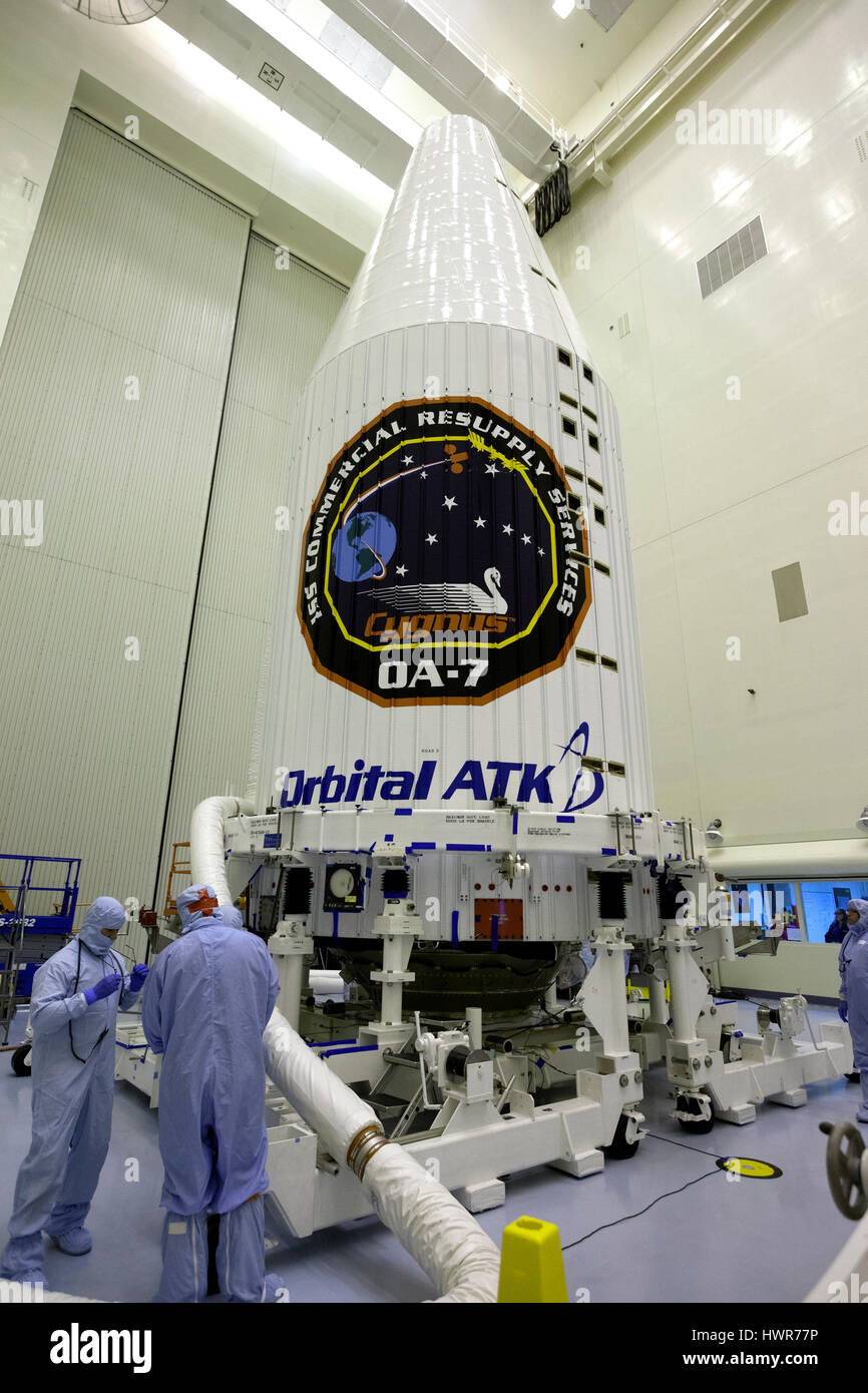 NASA technicians encapsulate the Orbital ATK Cygnus pressurized cargo module in the United Launch Alliance Atlas V payload fairing during final preparations at the United Launch Alliance Payload Hazardous Servicing Facility at the Kennedy Space Center March 10, 2017 in Cape Canaveral, Florida. The Orbital ATK CRS-7 commercial resupply services mission to the International Space Station is scheduled to launch March 24, 2017. Stock Photo