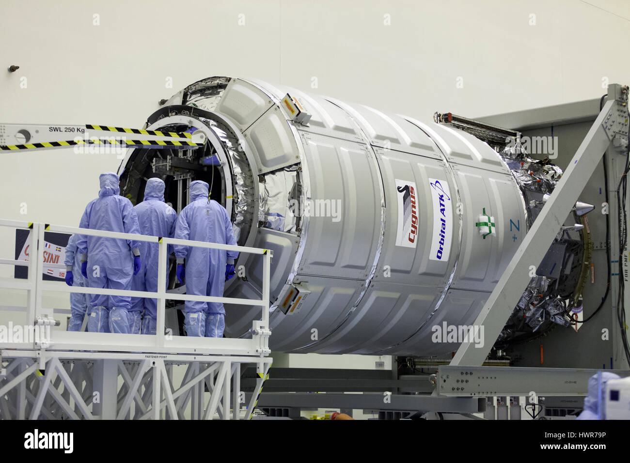 NASA technicians load cargo into the Orbital ATK Cygnus pressurized