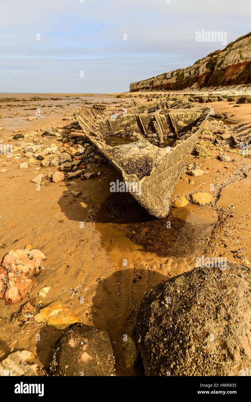HUNSTANTON, ENGLAND - MARCH 10: Shipwreck of the wooden steam trawler ship/boat 'Sheraton' slowly deteriorating on Hunstanton beach. HDR image. In Hun Stock Photo