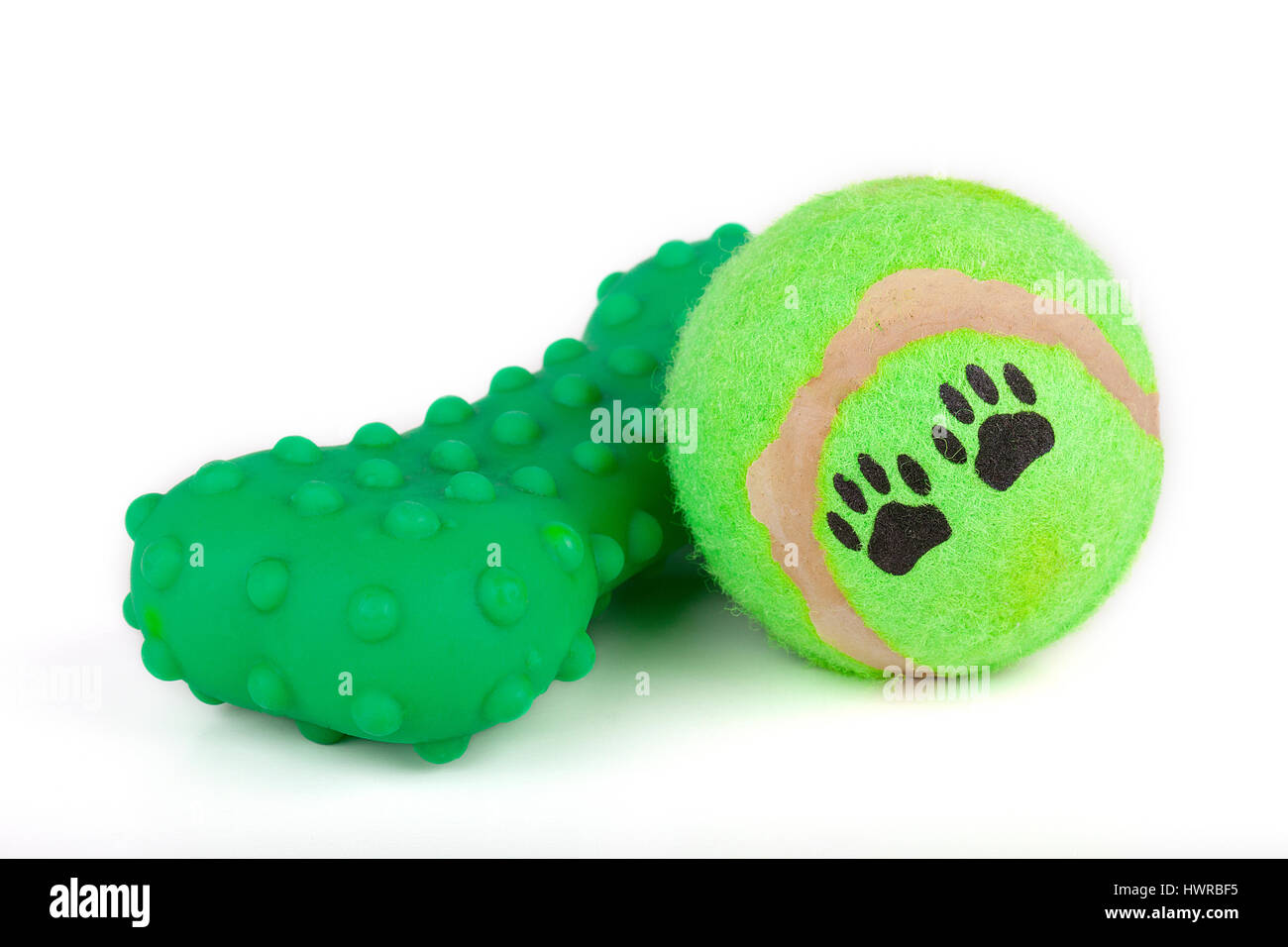 Colorful dog toys on a white surface. Bright tennis ball with paw prints.  Rubber toy. Toys isolated on white background Stock Photo - Alamy