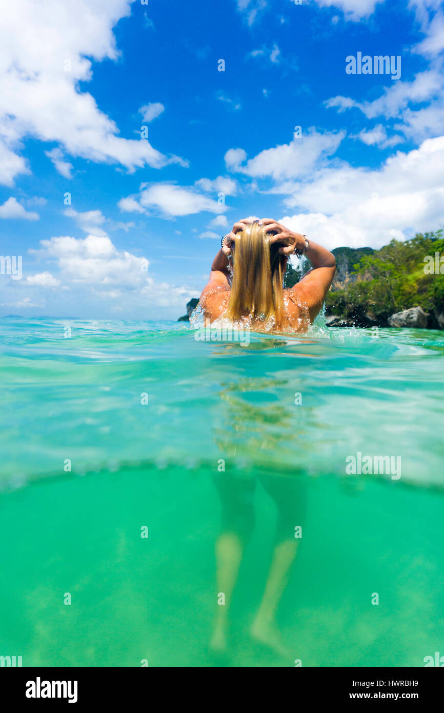 Split shot of a woman in the sea in Thailand Stock Photo - Alamy