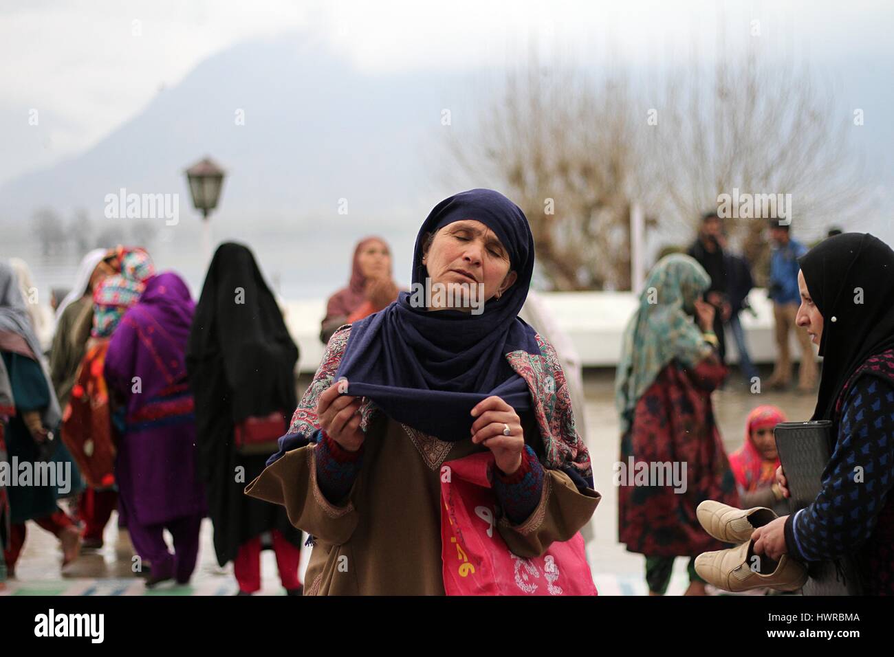 Near Srinagar, Kashmir. 22nd Mar, 2017. A Kashmiri Muslim woman prays ...