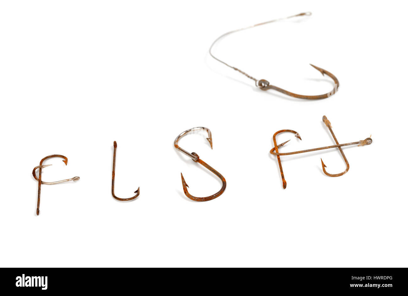 Word F I S H composed of old rusty fish hooks. Isolated on white background  with copy space. Selective focus Stock Photo - Alamy