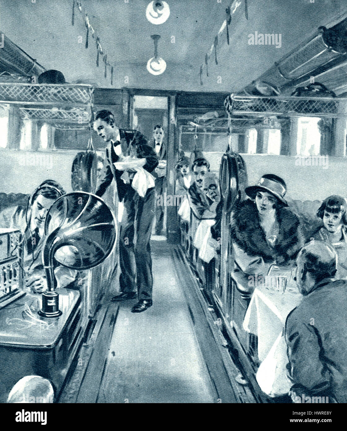 Dining car of the London - Liverpool express train fitted with a Marconi six-valve receiver to play concerts via radio to passengers, 1923 Stock Photo