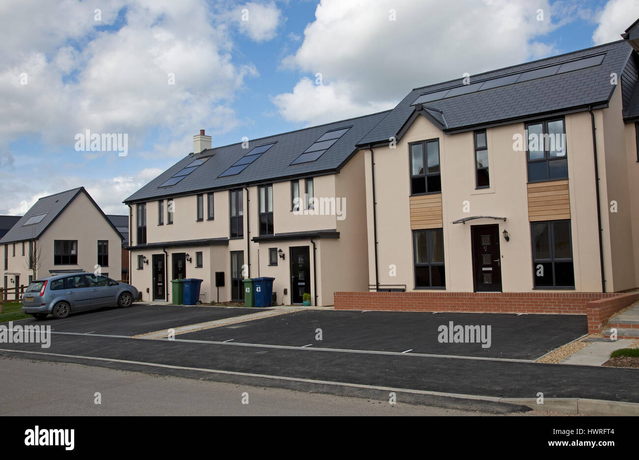 New houses 2017 all with solar black PV panels Persimmon Greenacres Bishops Cleeve Cheltenham UK Stock Photo