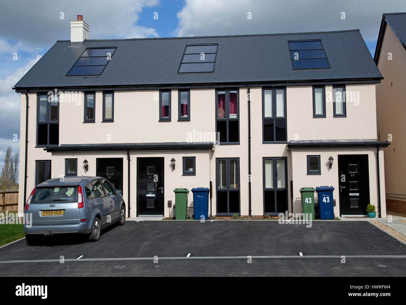New houses starter homes all with solar black PV panels Persimmon Greenacres Bishops Cleeve Cheltenham UK Stock Photo