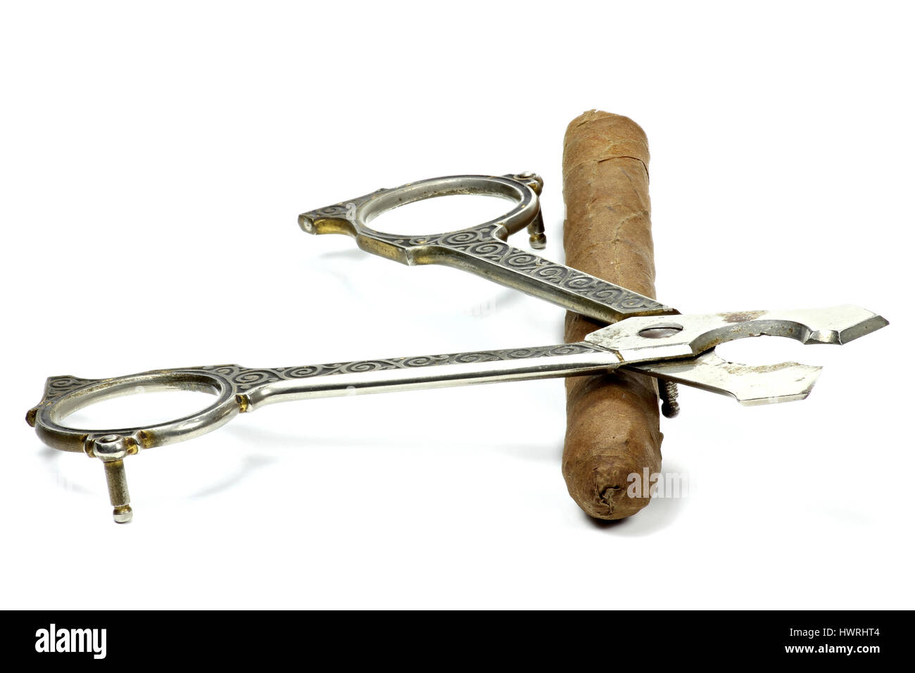 cigar with scissors isolated on white background Stock Photo