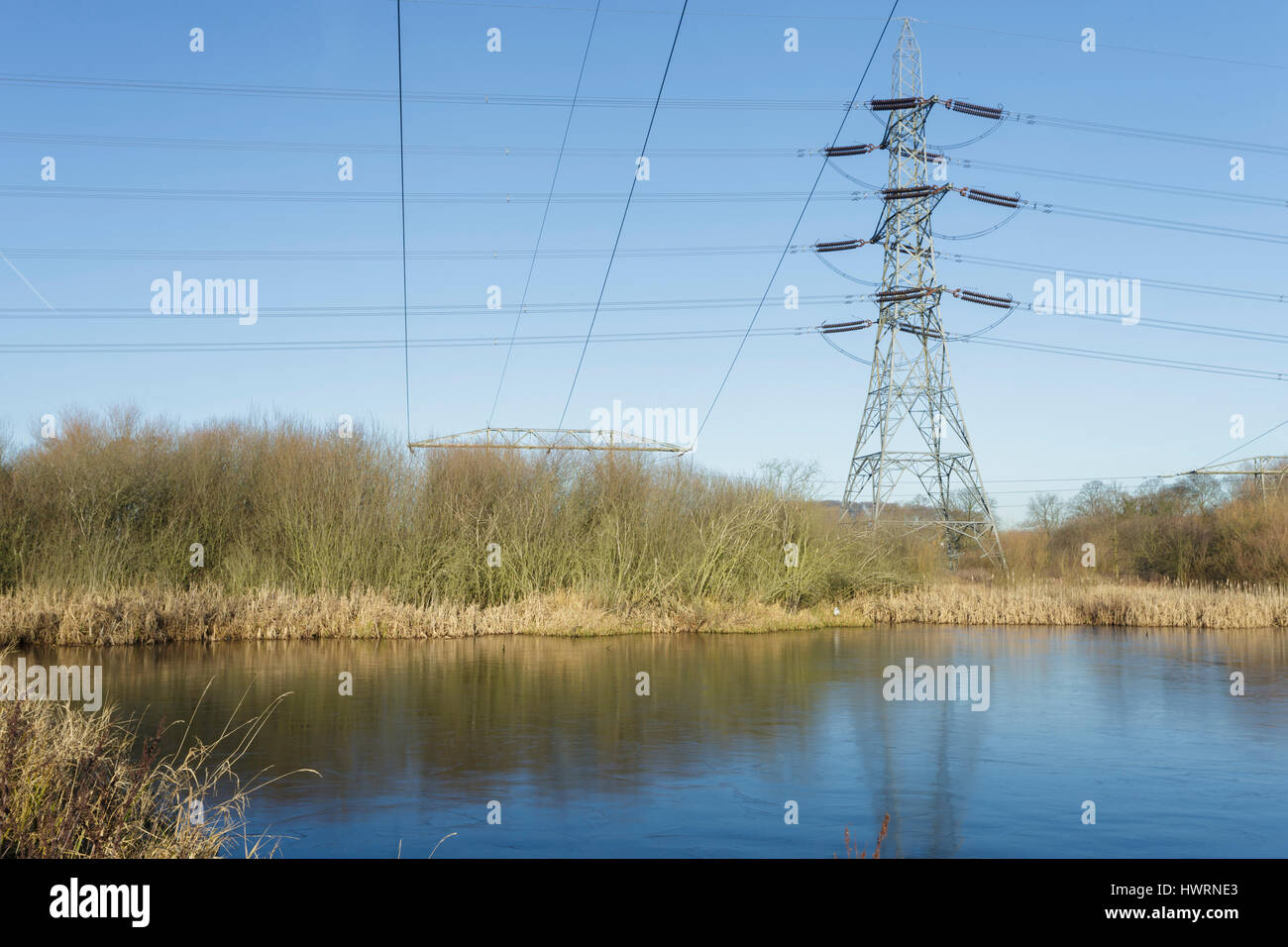 Electicity pylons near pool, Fairburn, West Yorkshire, England, January ...