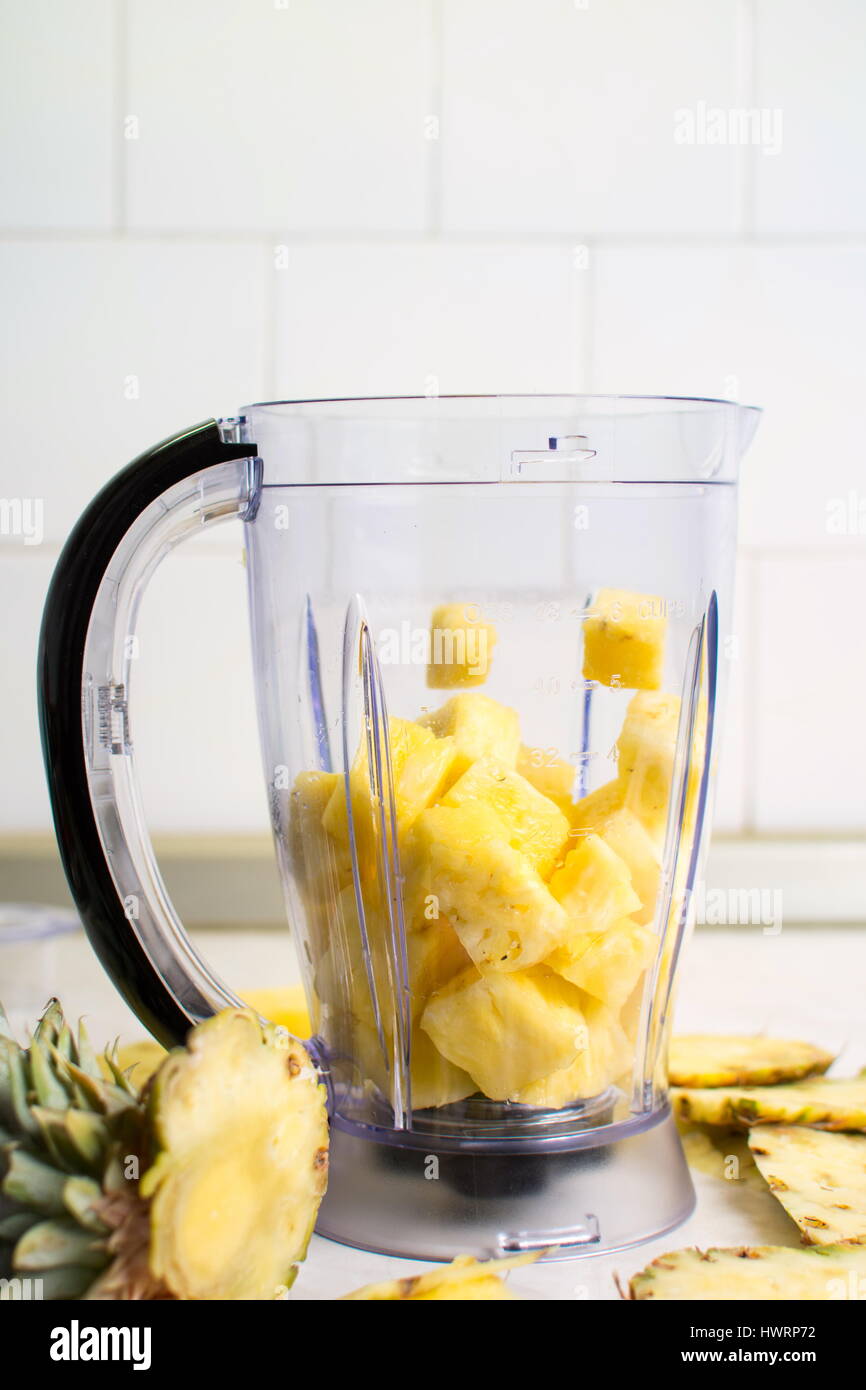 Pineapple in a blender for homemade smoothie Stock Photo Alamy