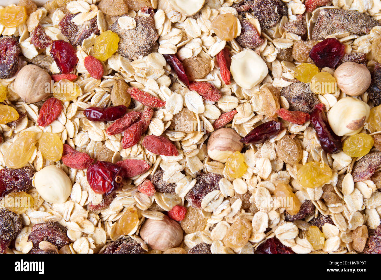 Oat flakes and dried fruit background pattern Stock Photo