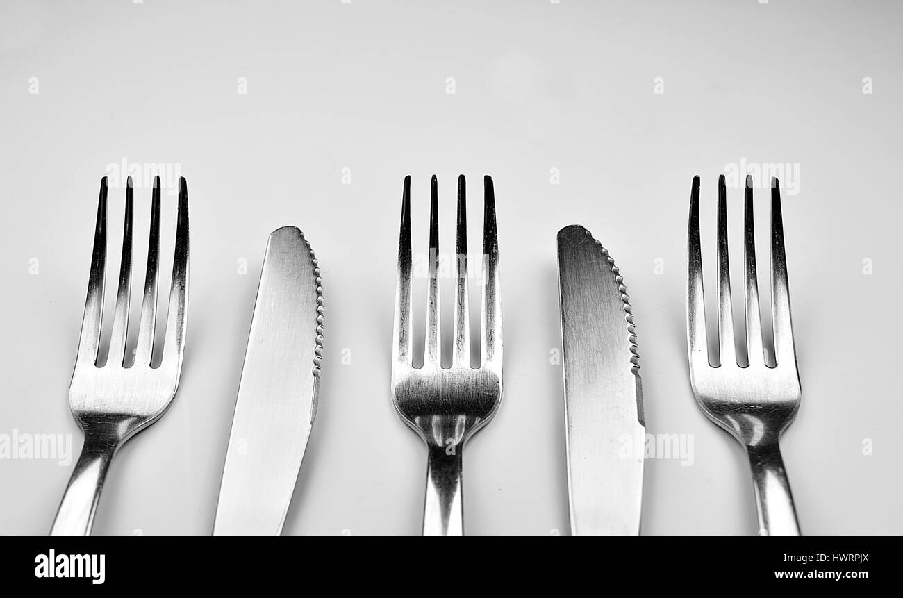 Forks and Knives isolated on white background Stock Photo