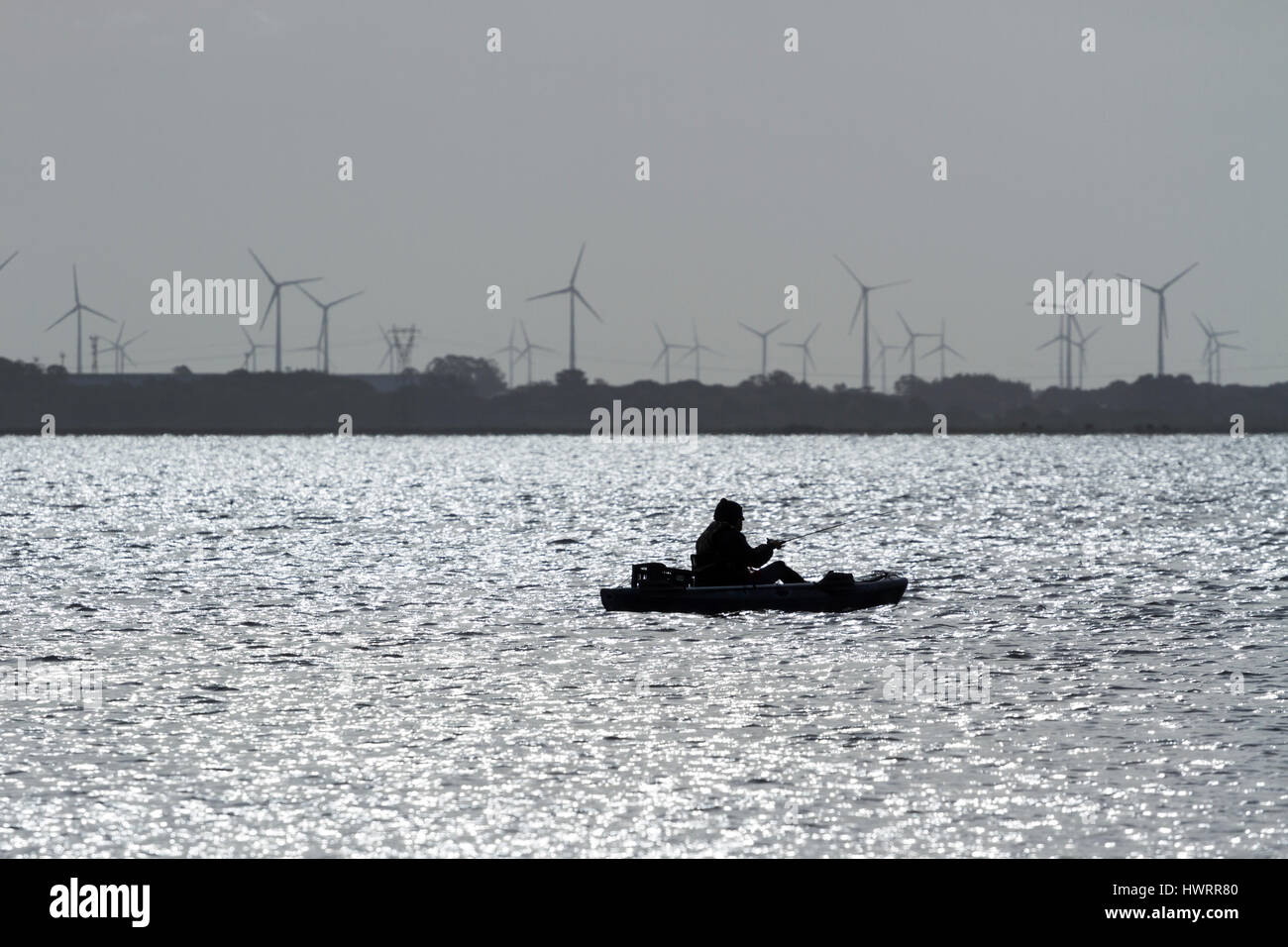 Lone fisherman on the river. Stock Photo